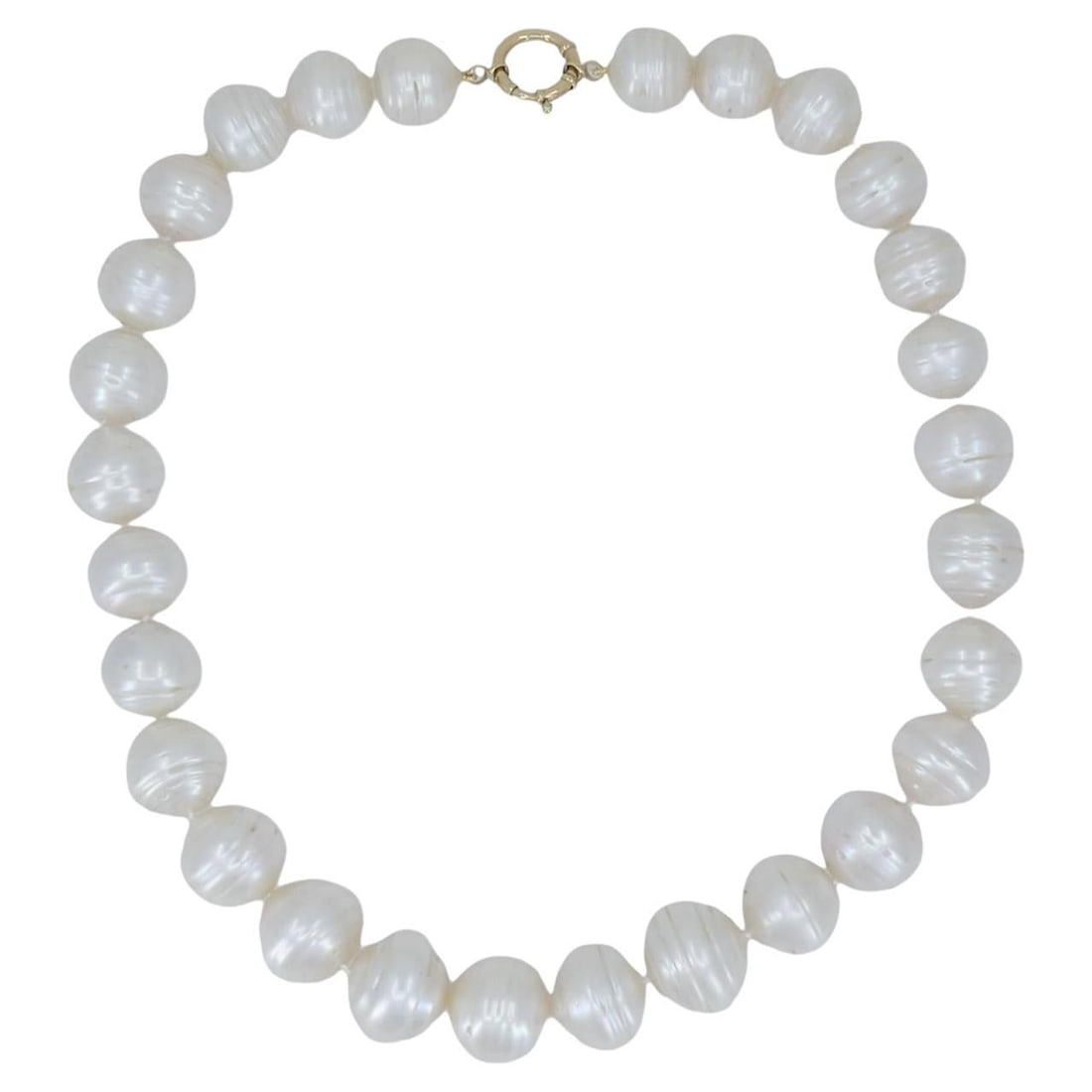 14k Gold Freshwater Cultured Pearl Strand Necklace 15.75 In: 14k Gold Freshwater Cultured Pearl Strand Necklace 15.75 In Vintage circa 1990s necklace featuring 28 lustrous freshwater cultured baroque pearls in a continuous strand. The pearls are white with natu