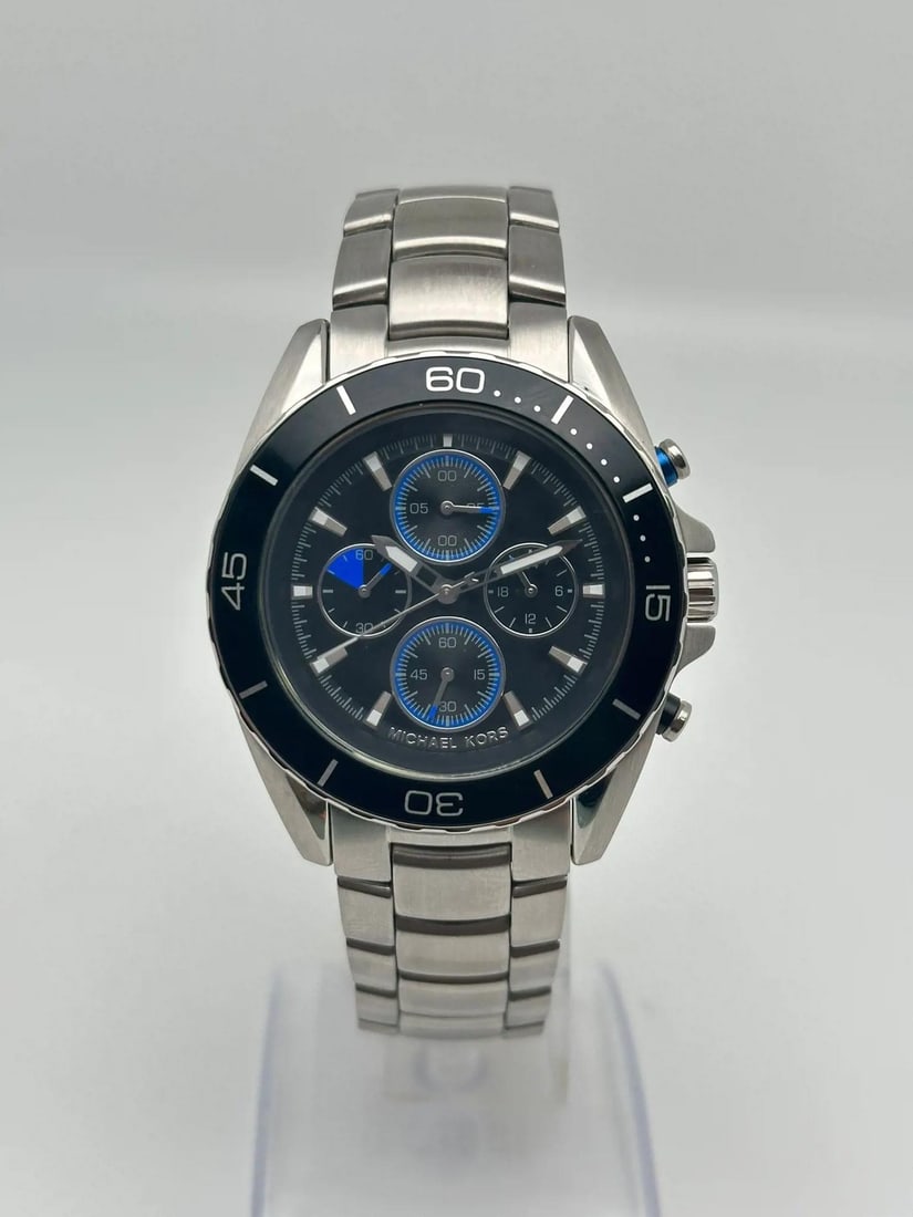Michael Kors MK8462 Jetmaster mens quartz chronograph watch black dial steel: Michael Kors MK8462 Jetmaster mens quartz chronograph watch black dial steel Michael Kors Jetmaster men's quartz wristwatch with a black analog dial, stainless steel bracelet, and rotating bezel. This