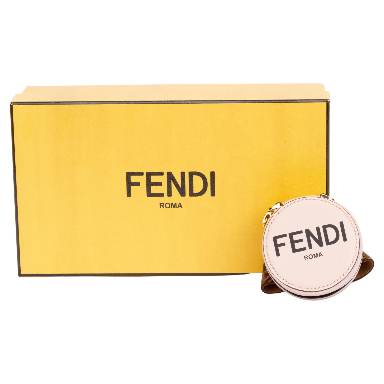 Fendi Leather Wrist Charm-Pods Case in Rose with Zipper: Fendi Leather Wrist Charm-Pods Case in Rose with Zipper This Fendi Wrist Charm-Pods Case is a stylish accessory that combines functionality and luxury. Crafted from high-quality leather in an elegant 