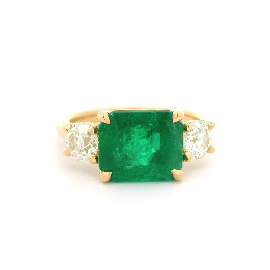 18k Yellow Gold GIA Certified 3.92ct Emerald Diamond Sideways Ring: 18k Yellow Gold GIA Certified 3.92ct Emerald Diamond Sideways Ring This exquisite cocktail ring features a stunning natural genuine emerald, expertly set in solid 18k yellow gold. The octagonal step c