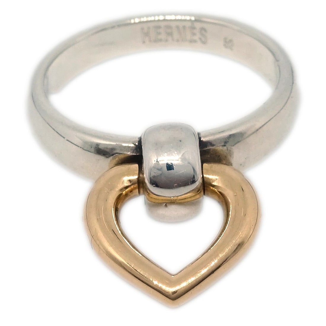 Tiffany Co Heart Ring SV925 18K Size 51 Vintage: Tiffany Co Heart Ring SV925 18K Size 51 Vintage Vintage Hermes Heart Knock ring in silver and 18K gold with a heart motif and no main stone. The ring shows scuffing and is in very good condition overa