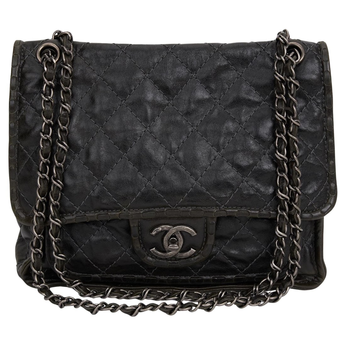 Chanel Paris-Edinburgh aged calfskin flap bag in black: Chanel Paris-Edinburgh aged calfskin flap bag in black Chanel Paris-Edinburgh black flap bag featuring aged calfskin construction with a gunmetal chain and leather-woven shoulder straps. The design in