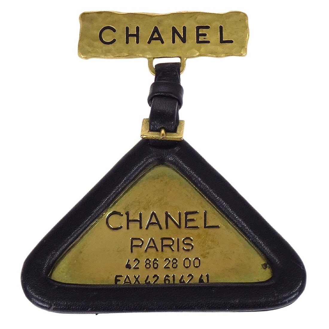 Chanel 94A Triangle Logo Brooch Pin Gold Tone Black: Chanel 94A Triangle Logo Brooch Pin Gold Tone Black Vintage Chanel triangle dangle brooch pin featuring the Chanel logo motif in gold-tone with black leather accents. Made in France, this brooch shows