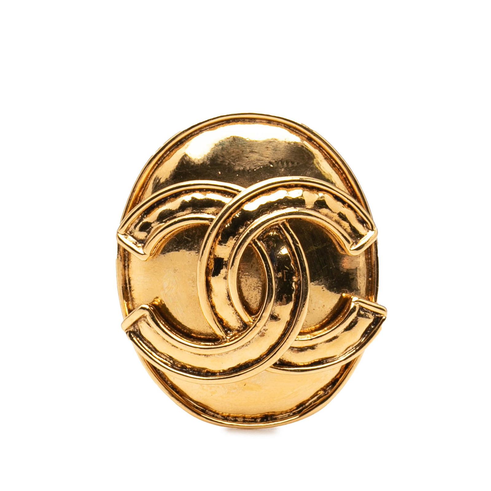 Chanel CC Oval Gold Tone Brooch Pin: Chanel CC Oval Gold Tone Brooch Pin This Chanel brooch features a gold-tone metal body with an oval shape and the iconic CC logo. It is designed with a secure back pin closure. The brooch is categoriz