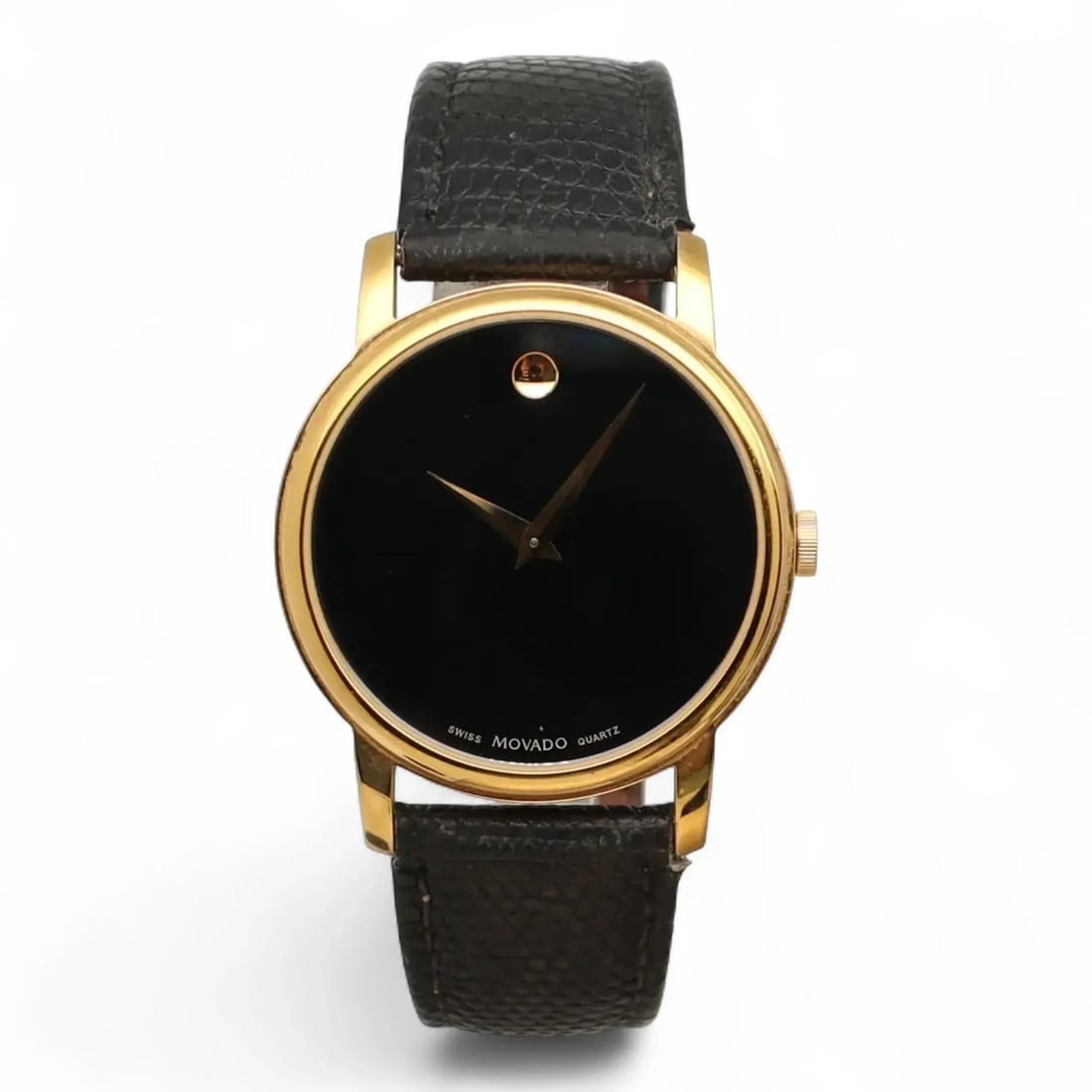 Movado Museum quartz wristwatch 39 mm black dial leather strap: Movado Museum quartz wristwatch 39 mm black dial leather strap Pre-owned Movado Museum wristwatch with a black dial and classic analog display. This Swiss-made quartz watch features a polished round s