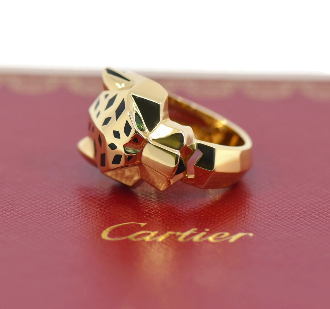 Cartier Panthere 18K Yellow Gold Ring with Onyx Size 57 Authentic: Cartier Panthere 18K Yellow Gold Ring with Onyx Size 57 Authentic This exquisite Cartier Panthere ring is crafted from 18K yellow gold, showcasing a striking onyx stone. The ring is a size 57 (approxi