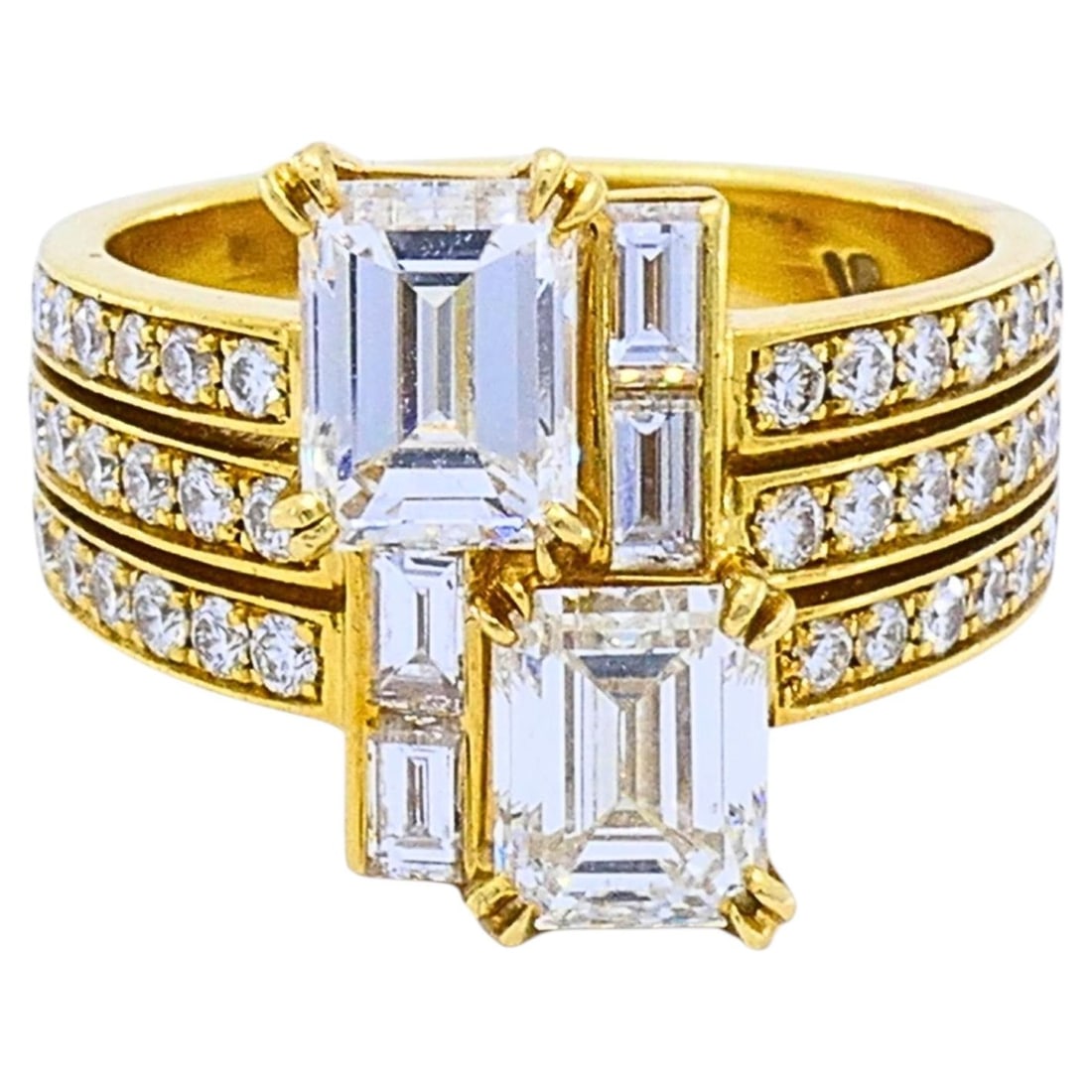 Chaumet 18k Gold Cocktail Ring with Emerald Cut and Baguette Diamonds: Chaumet 18k Gold Cocktail Ring with Emerald Cut and Baguette Diamonds Chaumet cocktail ring in 18k gold featuring emerald-cut, baguette, and round brilliant diamonds in a geometric, architectural desi