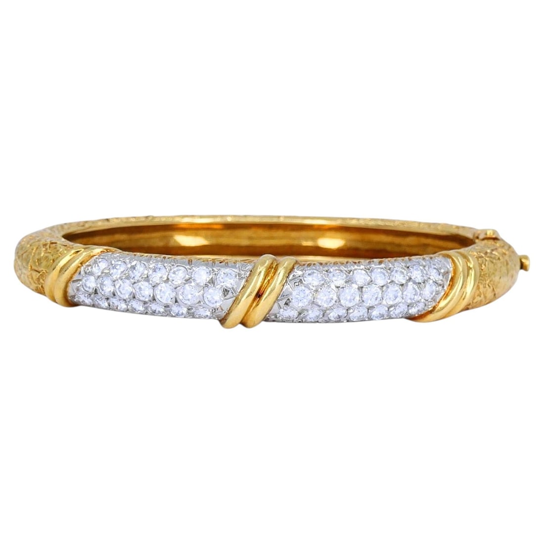 Van Cleef Arpels 1975 diamond hinged bangle in 18k gold platinum: Van Cleef Arpels 1975 diamond hinged bangle in 18k gold platinum Vintage Van Cleef & Arpels hinged bangle bracelet from 1975, crafted in 18k yellow gold with platinum detailing and a brilliant-cut dia