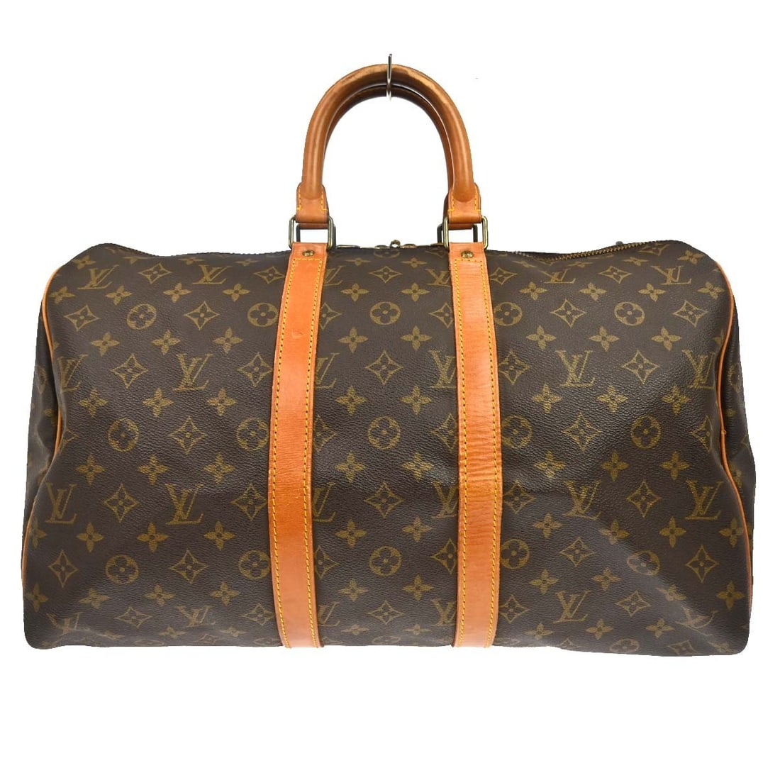 Louis Vuitton Keepall Brown Monogram Canvas Travel Bag: Louis Vuitton Keepall Brown Monogram Canvas Travel Bag Louis Vuitton Keepall in brown monogram canvas. This unisex travel bag is presented in good condition with visible wear. The exterior leather sho