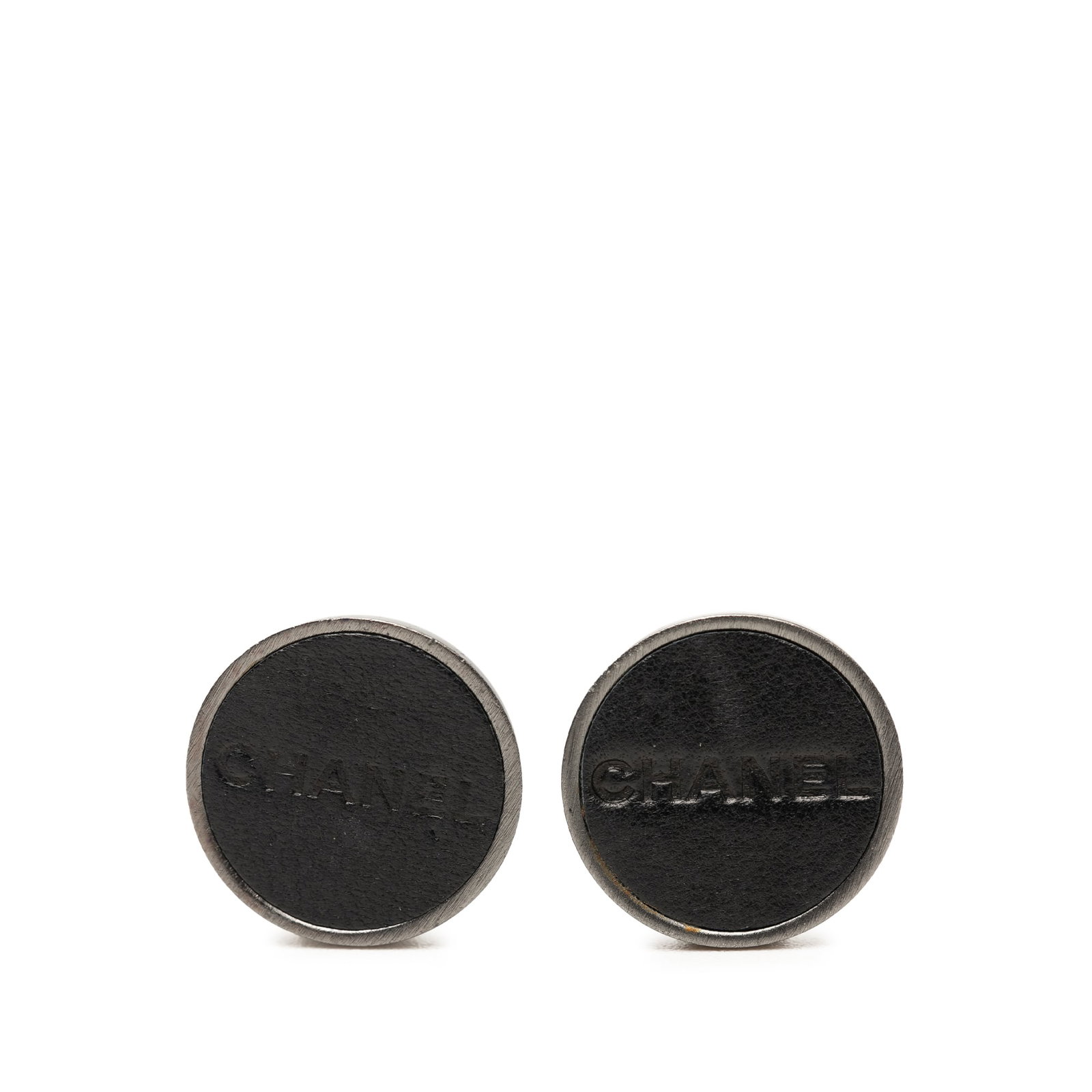Chanel Logo Clip Earrings Silver Tone Metal Leather: Chanel Logo Clip Earrings Silver Tone Metal Leather Chanel brass leather logo clip-on earrings in silver-tone metal and leather. These costume earrings are made in France and feature clip-on closures.