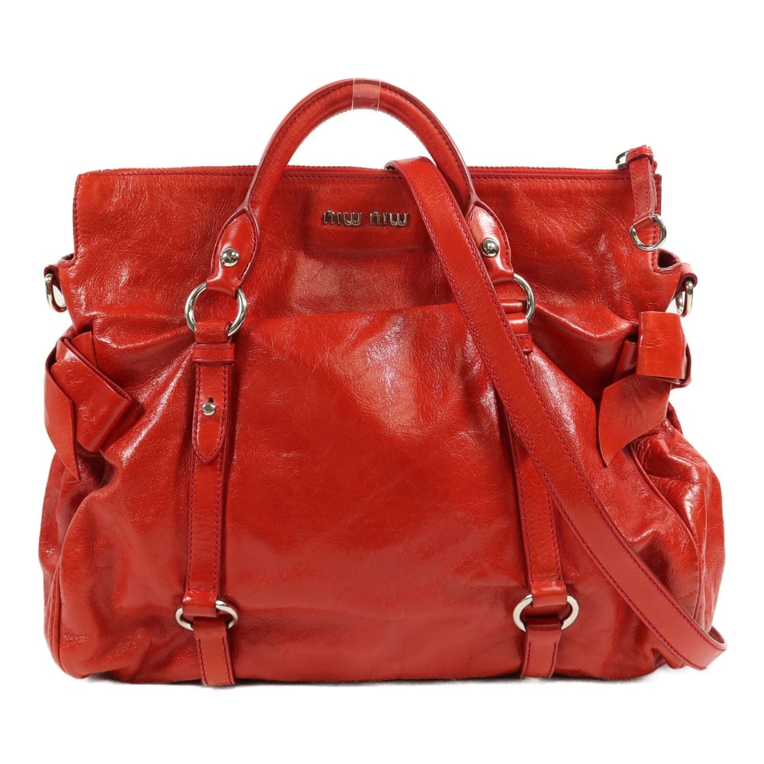 Miu Miu red calfskin 2way bag with shoulder strap: Miu Miu red calfskin 2way bag with shoulder strap Miu Miu 2way shoulder bag in red calfskin leather with a structured design and gold-tone hardware. This women's bag includes top handles and a detacha