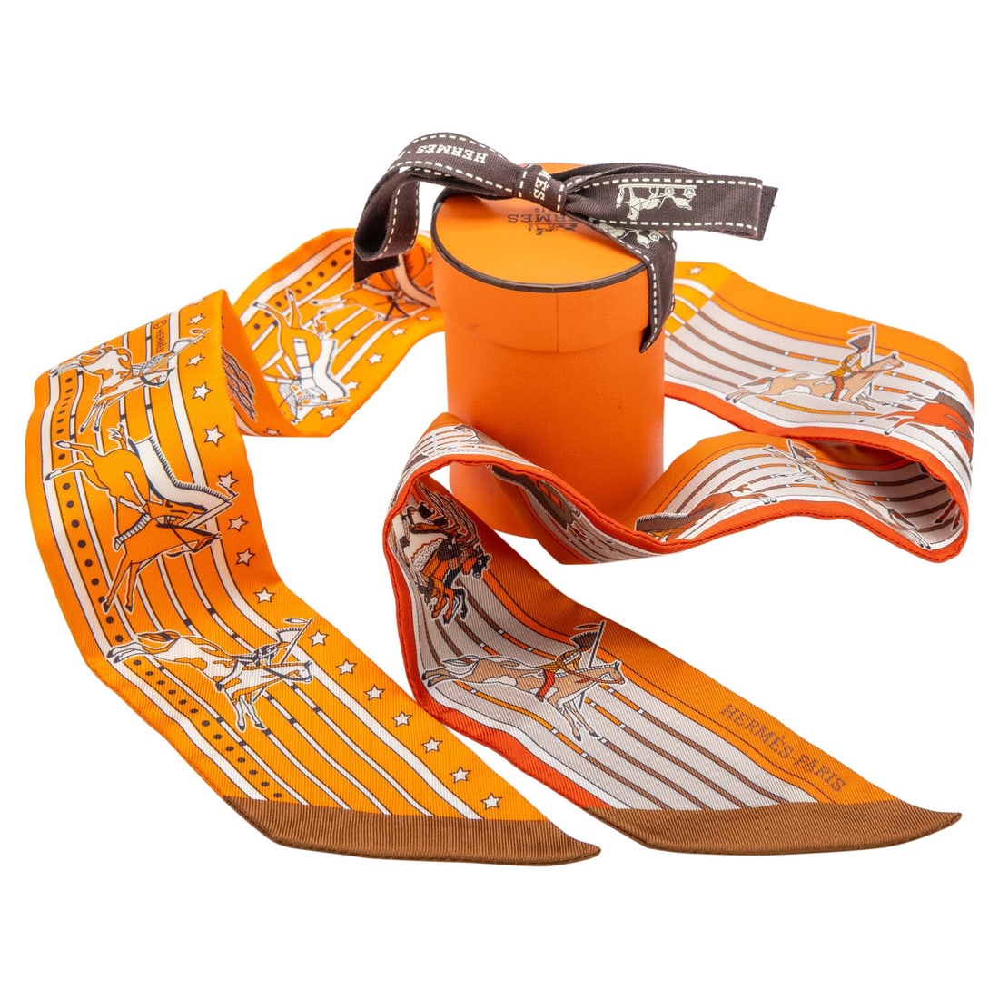 Hermes Kachinas Twilly Silk Scarf in Box: Hermes Kachinas Twilly Silk Scarf in Box Introducing the exquisite Hermes Kachinas Twilly, a stunning accessory from the renowned 21st Century collection. Crafted from luxurious silk, this twilly feat