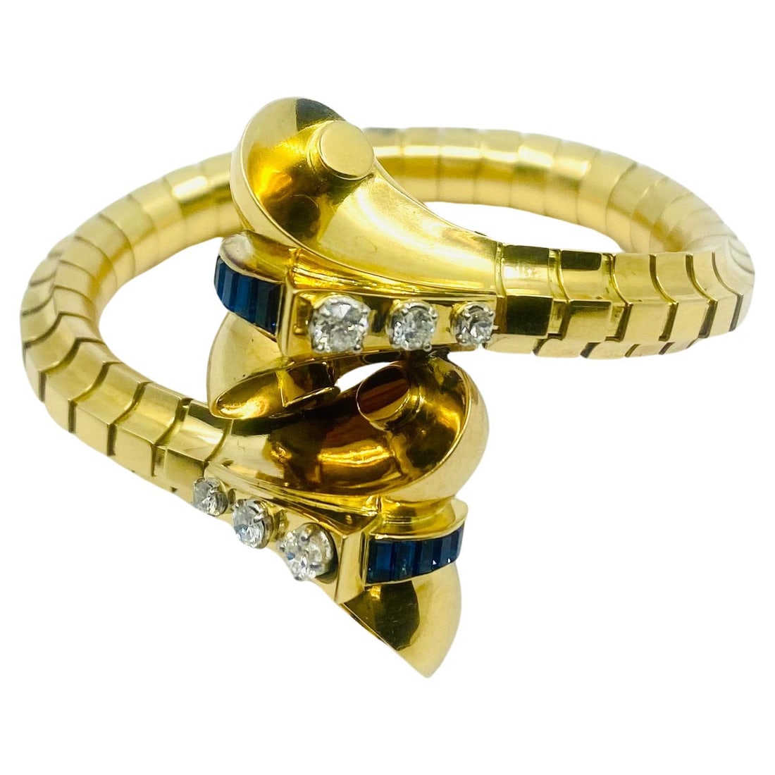 Van Cleef Arpels Cobra Bracelet 18k Yellow Gold Diamond Sapphire: Van Cleef Arpels Cobra Bracelet 18k Yellow Gold Diamond Sapphire A vintage Retro-era bracelet in a snake design, crafted in 18k yellow gold and set with diamonds and sapphires. The bracelet is formed 
