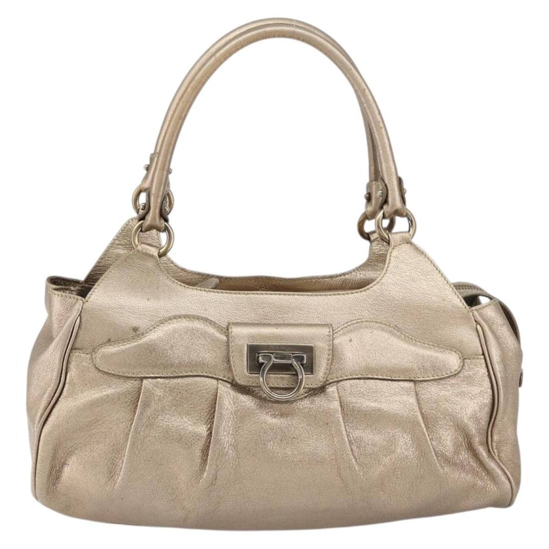 Leather Gancini Tote Bag by Salvatore Ferragamo in Gold: Leather Gancini Tote Bag by Salvatore Ferragamo in Gold This Salvatore Ferragamo Gancini Tote is crafted from gold leather, designed for women. It features a spacious interior with pockets and metal f