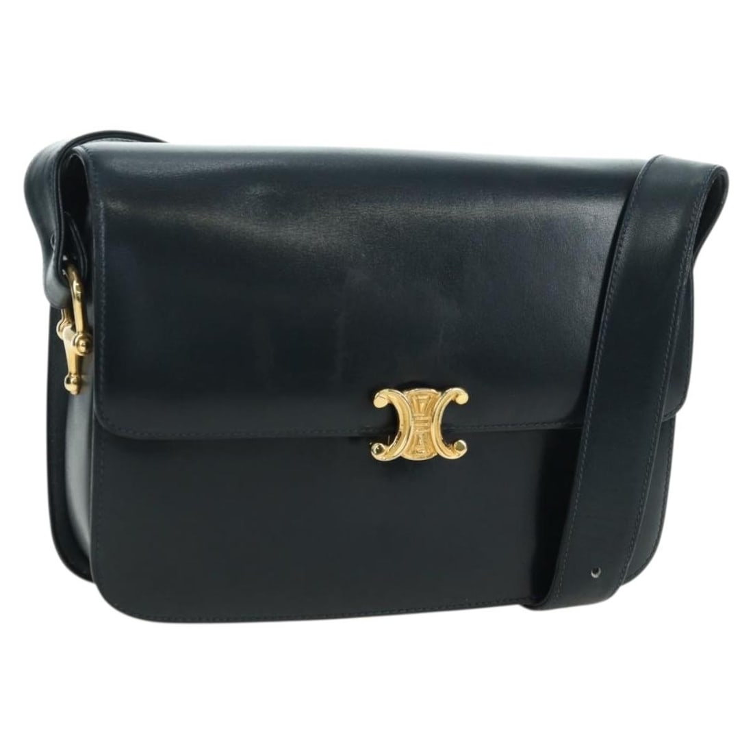 CELINE Triomphe navy leather shoulder bag gold tone Italy: CELINE Triomphe navy leather shoulder bag gold tone Italy This CELINE Triomphe shoulder bag is crafted from navy leather with gold-tone accents. Designed for women, it features a structured silhouette