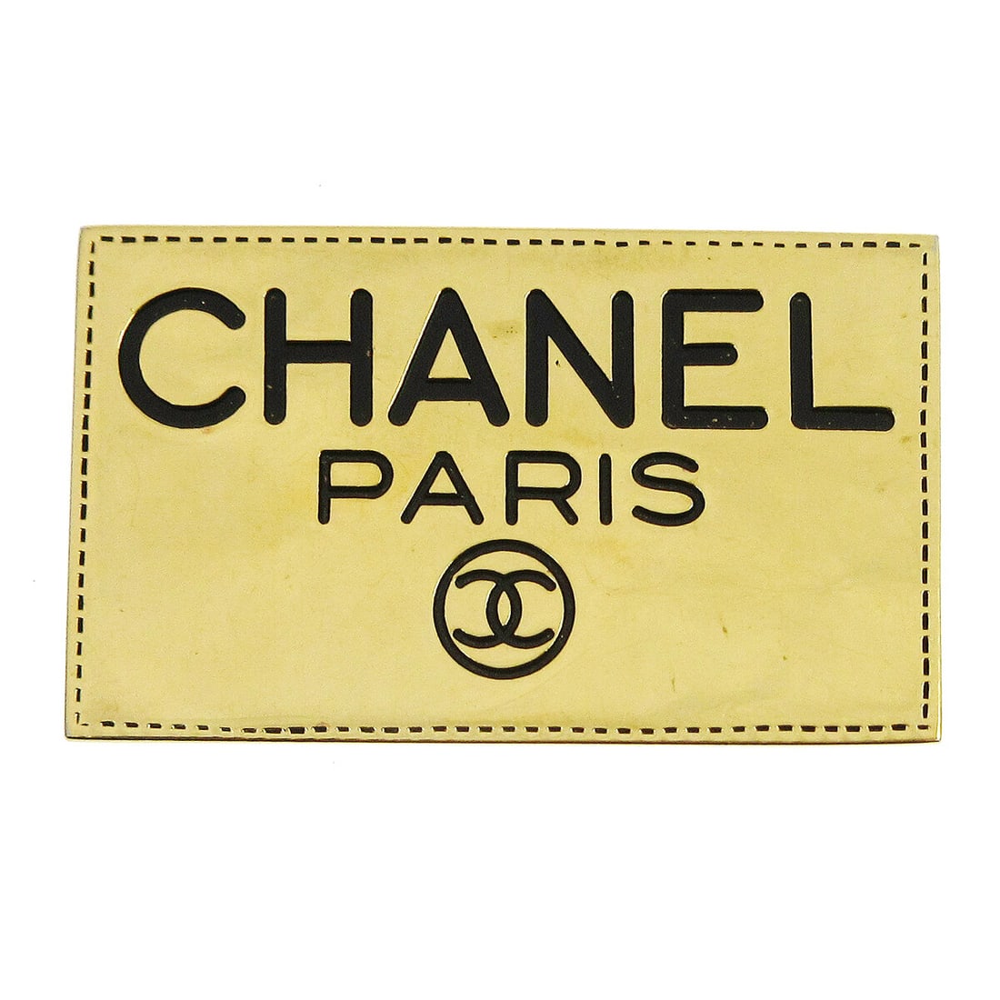 Chanel gold tone logo plate brooch pin: Chanel gold tone logo plate brooch pin Gold-tone Chanel brooch pin with a plate motif and logo theme. The piece features CHANEL CC logos and comes with a box. Condition shows reasonable wear and tear.