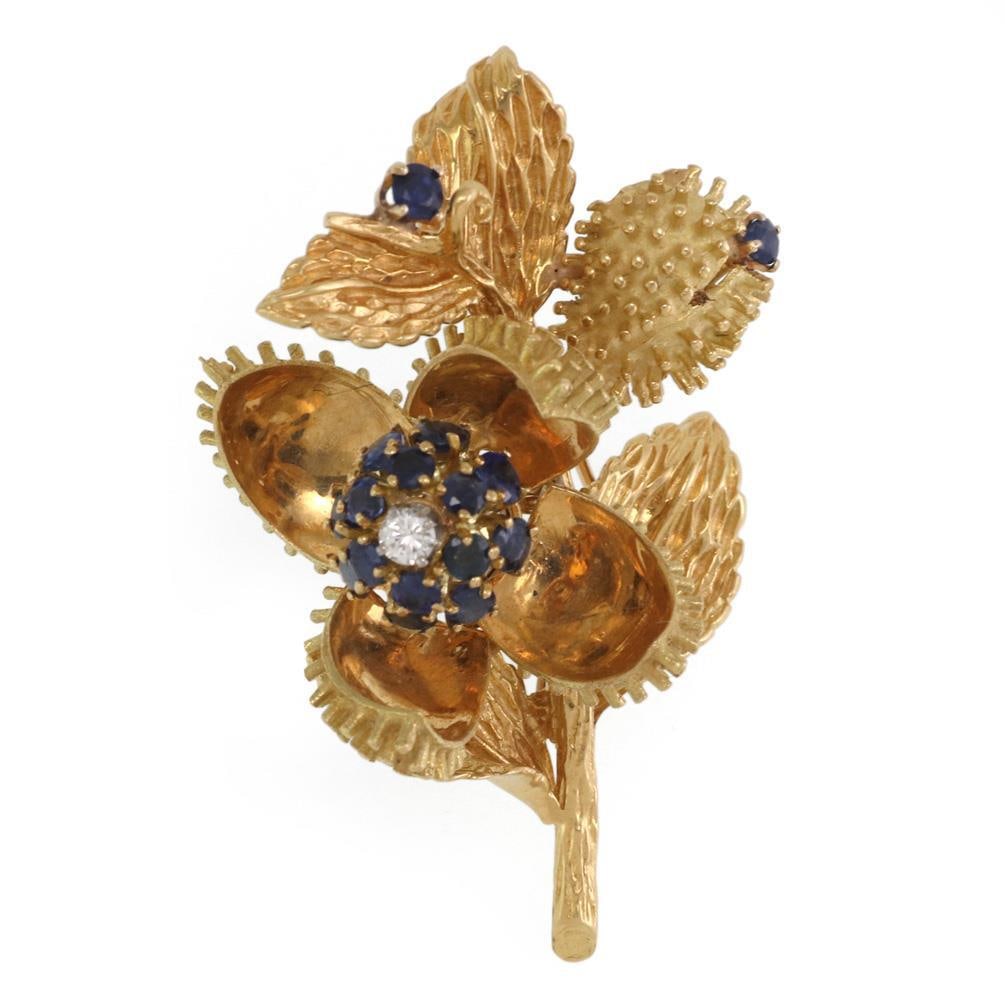 Tiffany & Co. 18k Gold Floral Movable Brooch with Diamonds and Sapphires: Tiffany & Co. 18k Gold Floral Movable Brooch with Diamonds and Sapphires Introducing a stunning vintage brooch from Tiffany & Co., crafted in luxurious 18k yellow gold. This exquisite piece features a