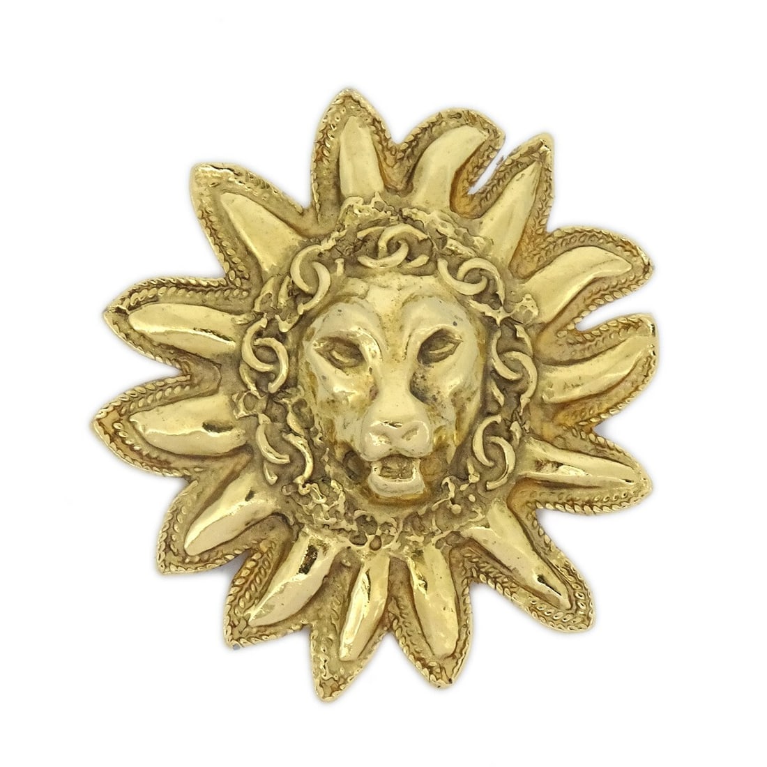 Chanel Lion Motif Gold Tone Logo Brooch Pin: Chanel Lion Motif Gold Tone Logo Brooch Pin Gold-tone Chanel brooch pin featuring a lion motif and logo theme. Made in France, this piece has a bold sunburst-style design with a lion's head at the cen