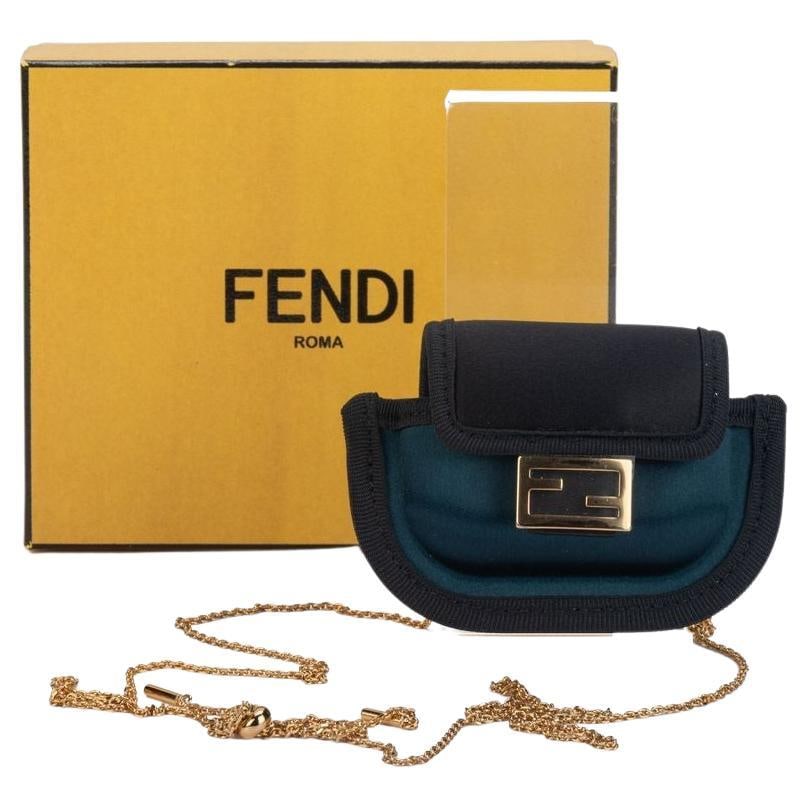 Fendi Micro Necklace Bag Petrol Green Leather NIB: Fendi Micro Necklace Bag Petrol Green Leather NIB This Fendi Micro Necklace Bag is a versatile accessory crafted from luxurious petrol green leather. With dimensions of 2.5 in (6.35 cm) in height, 1.5