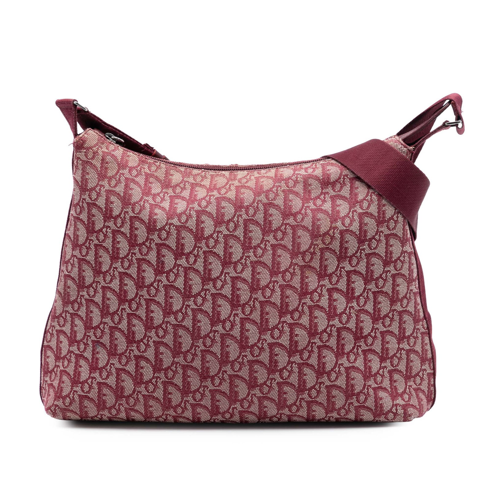 Dior Diorissimo Trotter red canvas crossbody bag: Dior Diorissimo Trotter red canvas crossbody bag Diorissimo Trotter crossbody bag in red canvas with an adjustable flat strap, top zip closure, and an interior zip pocket. Made in Italy. Condition B+ 