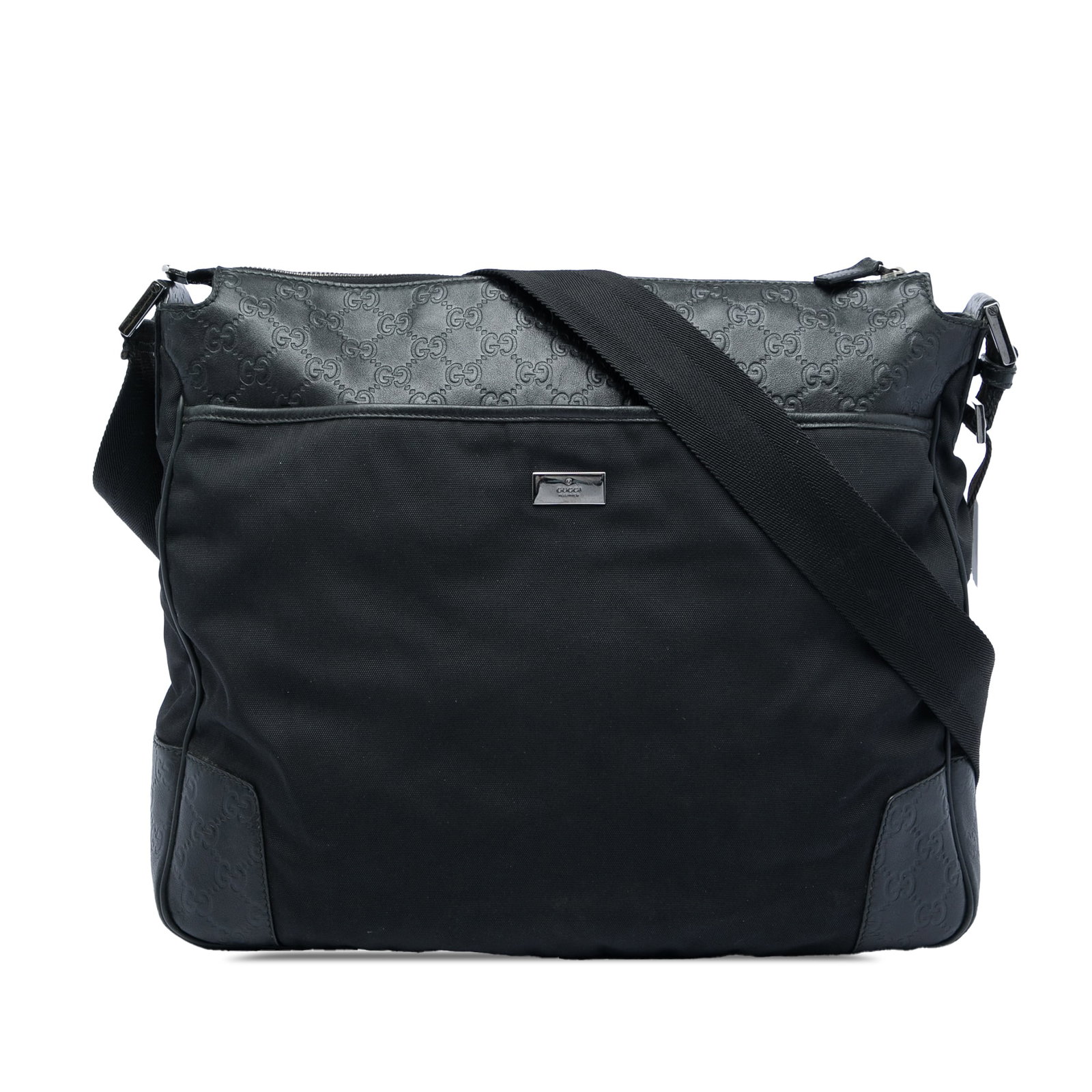 Gucci Guccissima canvas crossbody bag with embossed leather trim: Gucci Guccissima canvas crossbody bag with embossed leather trim Gucci Guccissima Trimmed Canvas Crossbody bag in black with an embossed leather and canvas body. It features a flat shoulder strap, an 