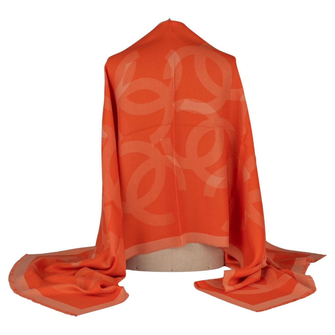Chanel Cashmere Shawl Orange with CC Logo 27 x 80 Inches Italy: Chanel Cashmere Shawl Orange with CC Logo 27 x 80 Inches Italy This exquisite Chanel cashmere shawl in vibrant orange is a statement accessory for any wardrobe. Crafted in Italy, it features a stunnin