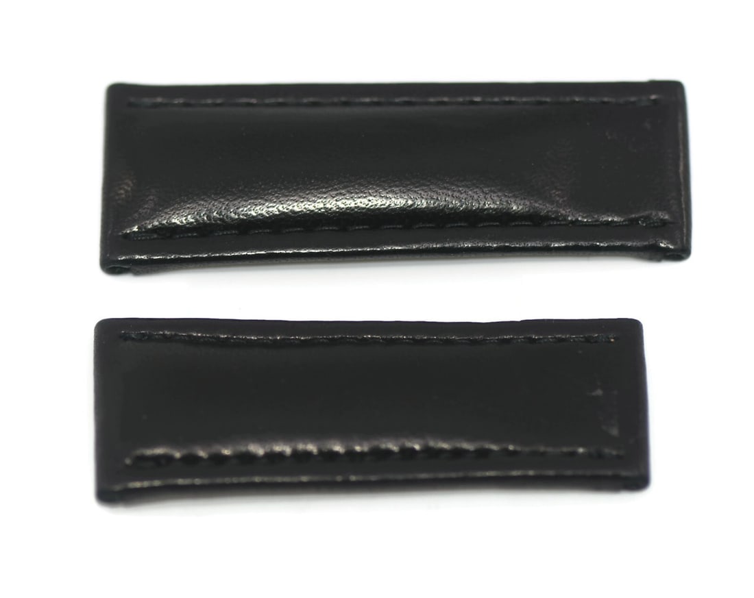 de Grisogono Authentic Black Leather Strap 25mm Two-Piece: de Grisogono Authentic Black Leather Strap 25mm Two-Piece Enhance your wristwatch with this authentic de Grisogono Black Leather Strap. Crafted from high-quality leather, this two-piece strap features