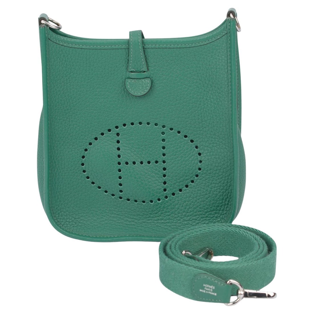 Hermes Evelyne TPM Green Clemence Leather Crossbody Palladium Hardware: Hermes Evelyne TPM Green Clemence Leather Crossbody Palladium Hardware The Hermes Mini Evelyne Vert Vertigo is crafted from Clemence leather in a striking green shade and features a canvas strap. This
