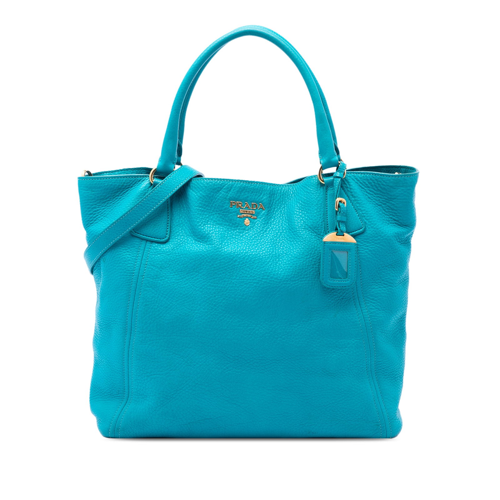 Prada Vitello Daino leather satchel tote with detachable strap: Prada Vitello Daino leather satchel tote with detachable strap Prada Vitello Daino Open Convertible Tote in blue leather with rolled top handles, a detachable flat strap, and an open top with magnetic