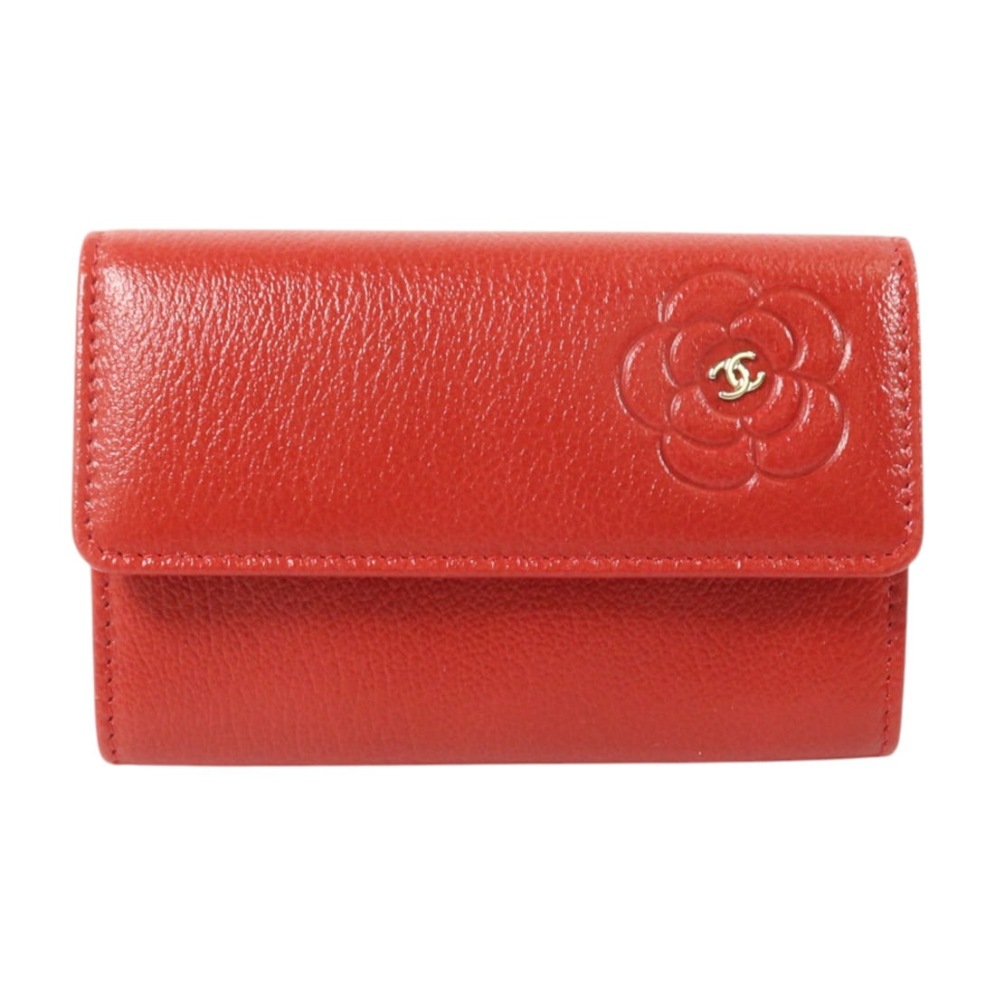 CHANEL Camellia CC Red Calfskin Card Case with SHW: CHANEL Camellia CC Red Calfskin Card Case with SHW Red calfskin card case with CC and Camellia design details. This women's card holder is made in France and features a hook button closure with a guss