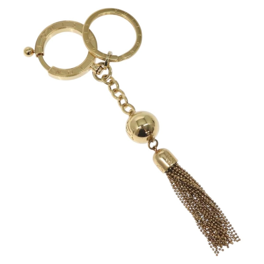 Louis Vuitton M65997 metal key holder in gold tone: Louis Vuitton M65997 metal key holder in gold tone Louis Vuitton Porte Cles Swing key holder in gold-tone metal. This women's key holder shows reasonable wear and tear with slight scratches on the sur