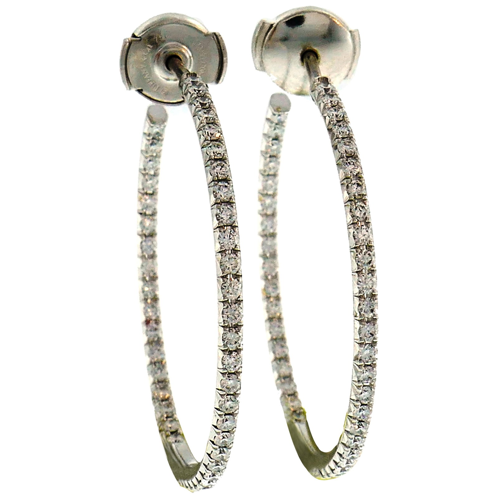 Tiffany Co 18k White Gold Diamond Hoop Earrings Pair: Tiffany Co 18k White Gold Diamond Hoop Earrings Pair Elegant Tiffany & Co. hoop earrings crafted in 18k white gold and set with diamonds. The earrings are a set of 2, made in Belgium during the 1990s,
