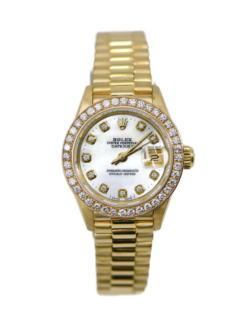 Rolex Datejust 6917 womens 18K yellow gold wristwatch with aftermarket diamonds: Rolex Datejust 6917 womens 18K yellow gold wristwatch with aftermarket diamonds Vintage Rolex Datejust reference 6917 women's wristwatch with a round polished 18K yellow gold case and matching yellow 