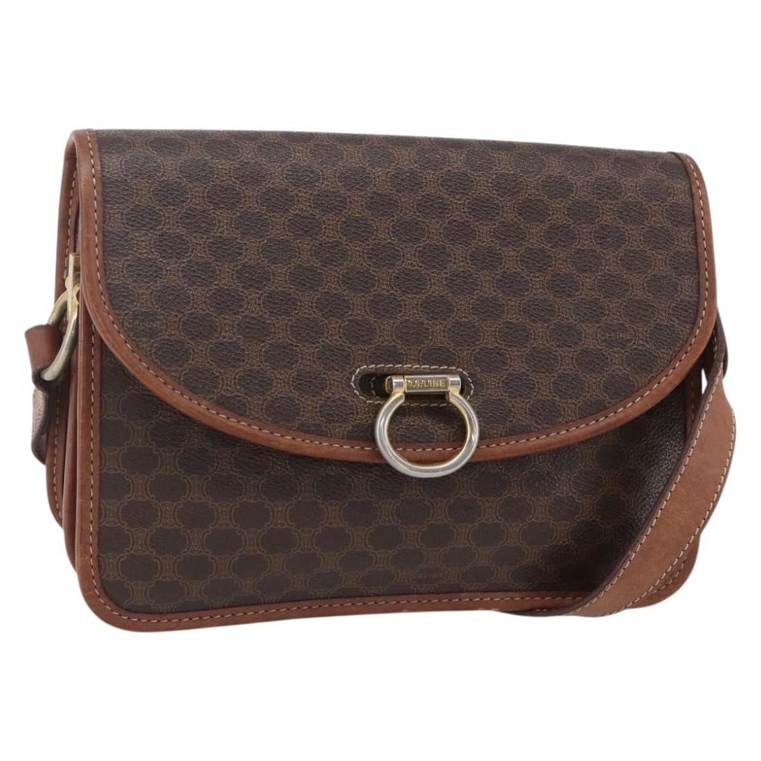 Celine Canvas Flap Shoulder Bag in Brown: Celine Canvas Flap Shoulder Bag in Brown This Celine Flap Shoulder Bag is crafted from brown canvas and designed for women. The bag features a structured flap closure and has visible signs of use, inc
