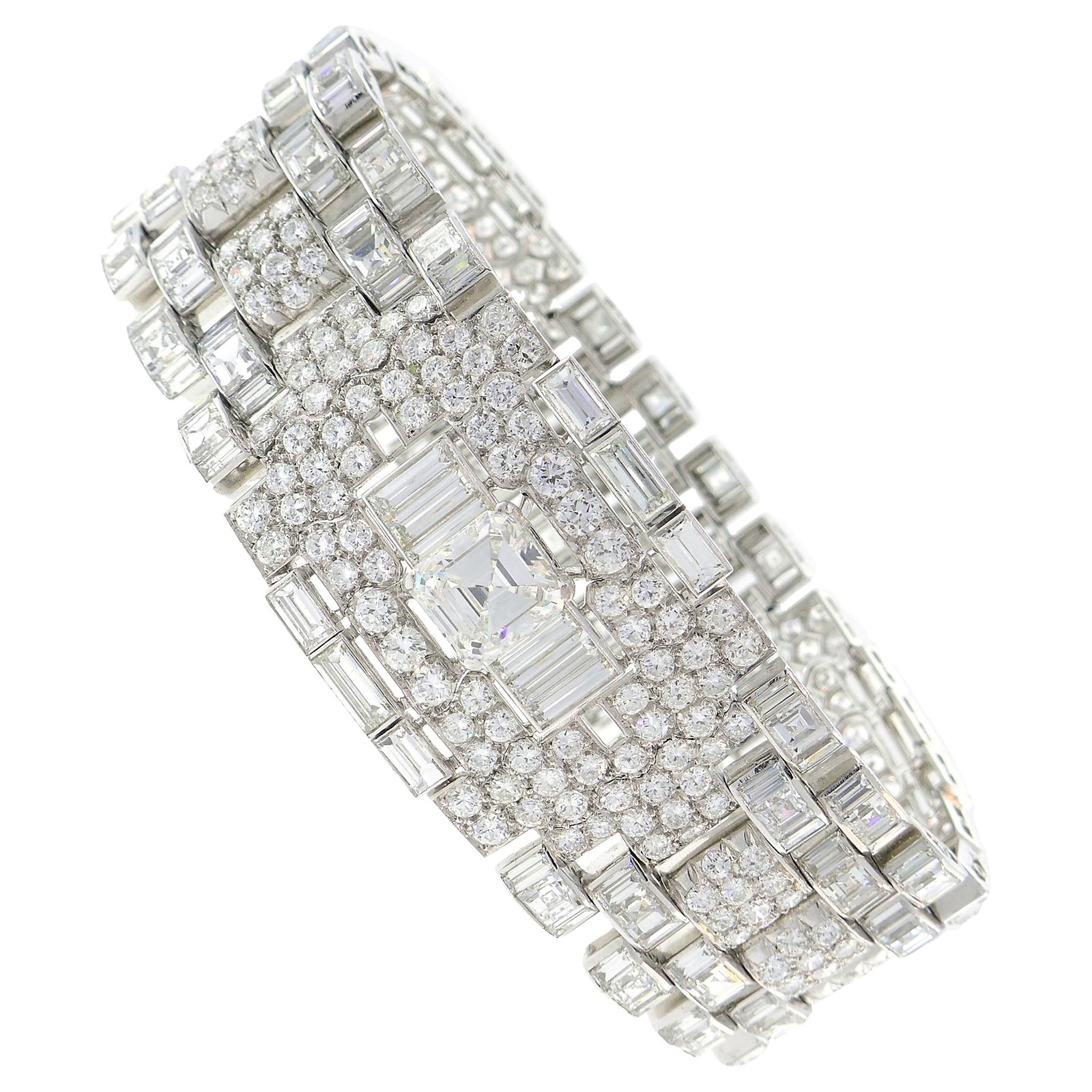 1960s platinum diamond bracelet Art Deco Revival style: 1960s platinum diamond bracelet Art Deco Revival style An Art Deco Revival bracelet from the 1960s, crafted in platinum and set with diamonds. It features three emerald cut diamonds along with round b