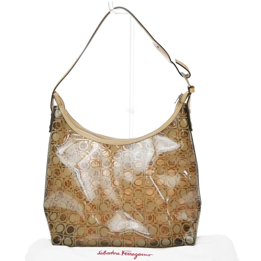 Salvatore Ferragamo Gancini Brown PVC Leather Handbag: Salvatore Ferragamo Gancini Brown PVC Leather Handbag Salvatore Ferragamo Gancini bag in brown PVC with leather trim. Made in Italy, this women's bag is presented in good condition with visible signs 