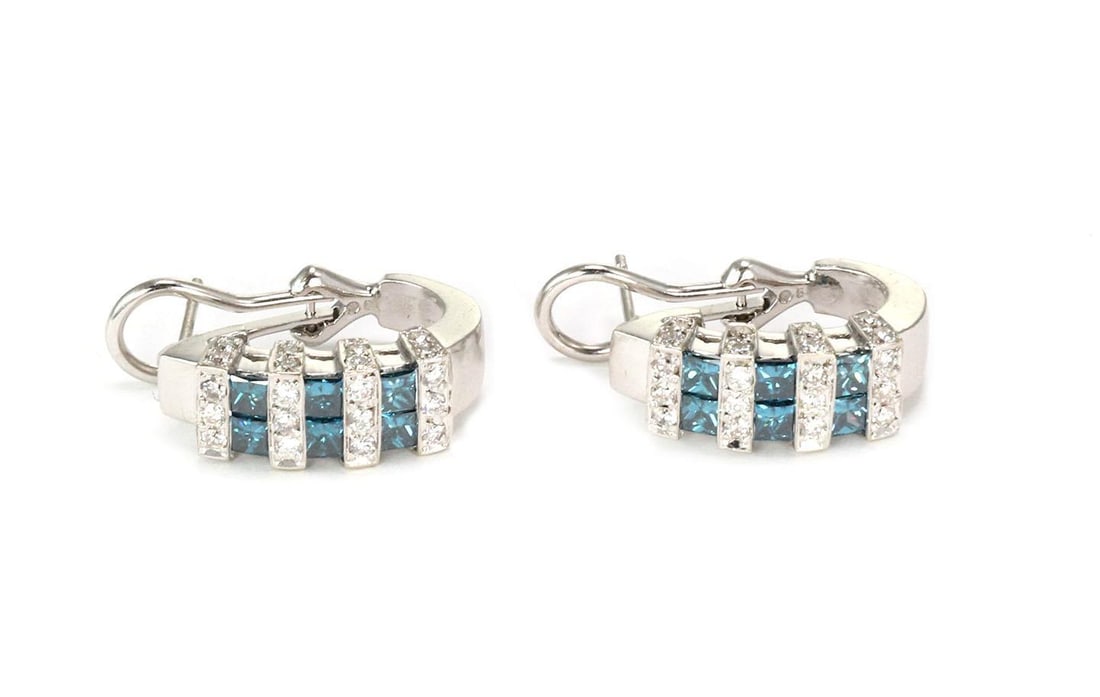 Stunning 14k White Gold Blue White Diamond Oval Hoop Earrings: Stunning 14k White Gold Blue White Diamond Oval Hoop Earrings Elevate your style with this stunning pair of oval hoop earrings, expertly crafted from 14k white gold. The earrings feature a graceful ov