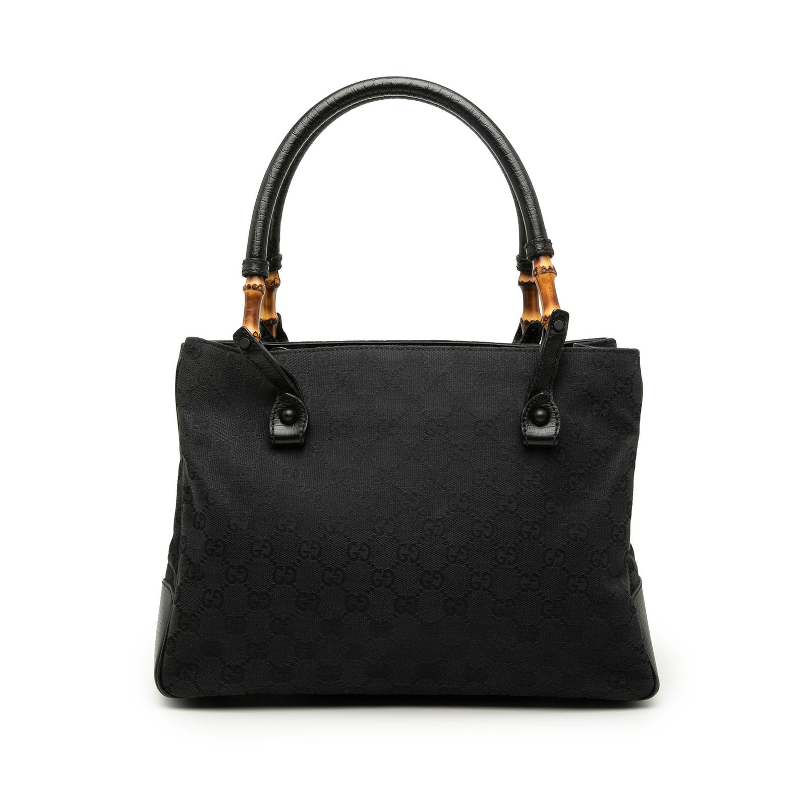 Gucci GG Canvas Bamboo Tote Bag Black Leather Trim: Gucci GG Canvas Bamboo Tote Bag Black Leather Trim Gucci GG Canvas Bamboo Tote in black canvas with leather trim. This tote features rolled leather handles with bamboo bullets, an open top, an interio