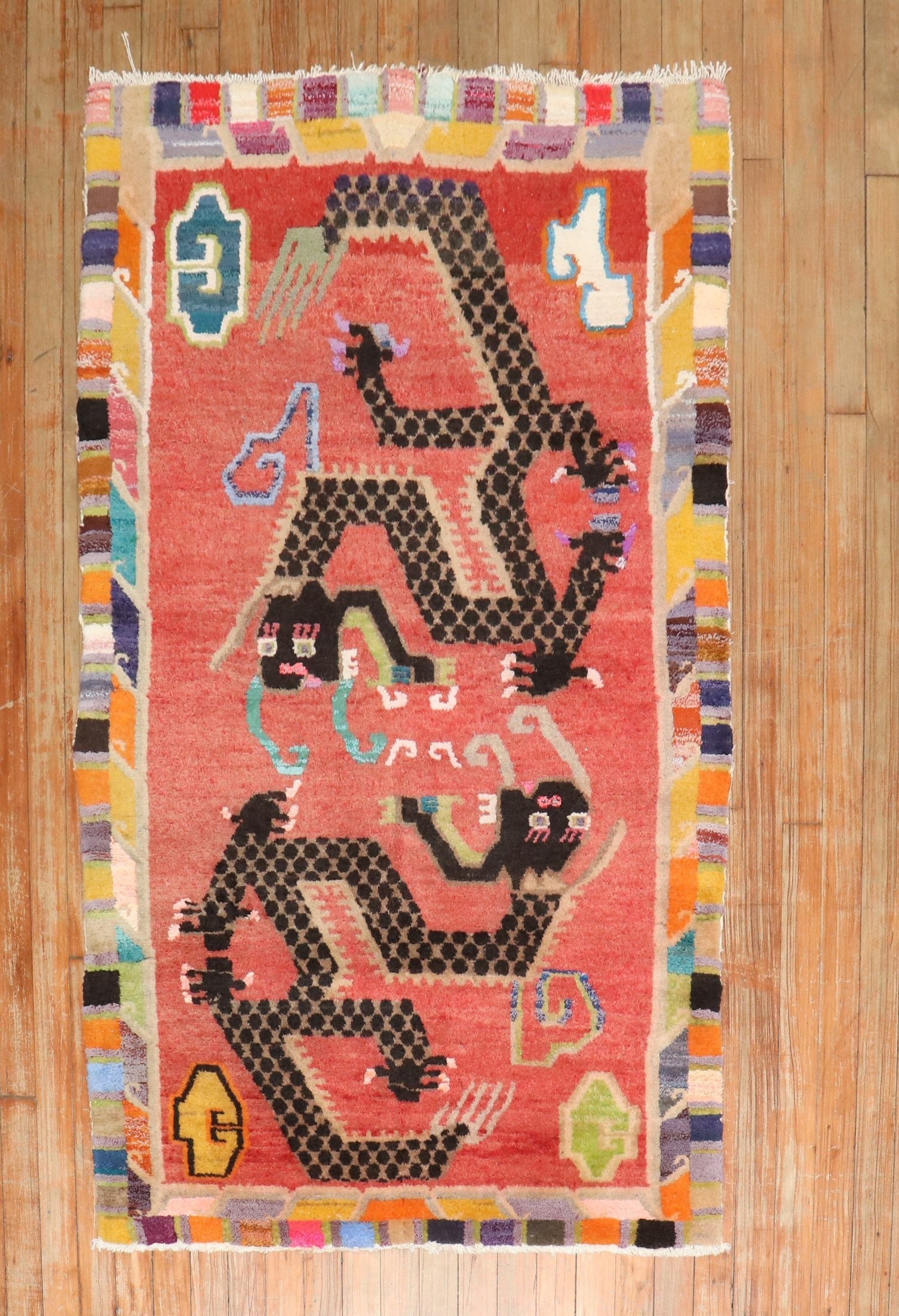 3' 1" x 5' 1" Pictorial Tibetan Dragon Rug: 3' 1" x 5' 1" Pictorial Tibetan Dragon Rug One-of-a-kind vintage Tibetan pictorial rug featuring a colorful dragon motif. This pre-owned small rug dates to the 2nd quarter of the 20th century and offe
