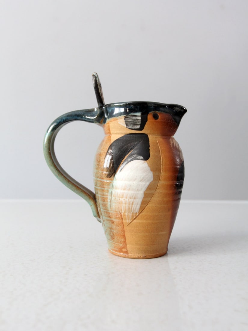 Whimsical Bird Shaped Lee Segal Studio Pottery Pitcher Vase: Whimsical Bird Shaped Lee Segal Studio Pottery Pitcher Vase This charming vintage pitcher vase, shaped like a bird, is crafted by Lee Segal of All Fired Up Pottery. It serves as a playful decorative a
