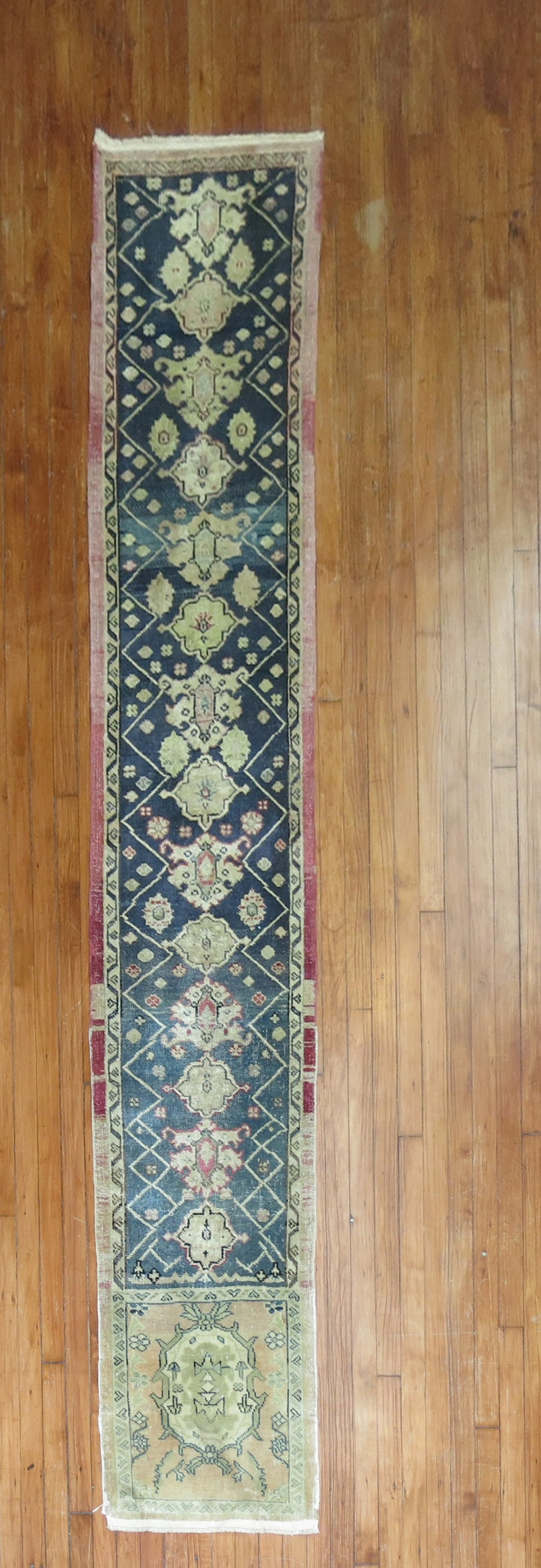 1' 9" x 10' 4" Turkish Anatolian runner rug: 1' 9" x 10' 4" Turkish Anatolian runner rug Turkish Anatolian runner from the 3rd quarter of the 20th century. This narrow pre-owned runner features a traditional patterned design consistent with the 