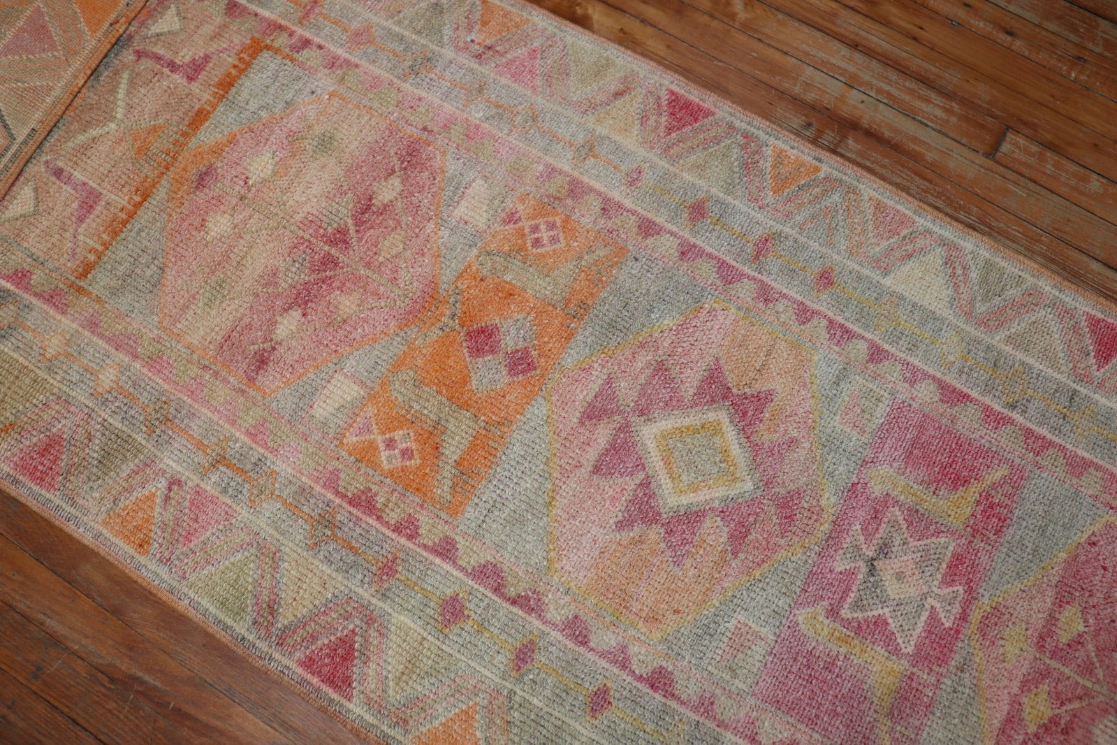 2' 10" x 21' 7" Anatolian Turkish Geometric Runner in Pastel Tones: 2' 10" x 21' 7" Anatolian Turkish Geometric Runner in Pastel Tones Mid 20th-century Turkish geometric runner in pastel tones with pink, orange, and cream accents. This Anatolian runner features a long