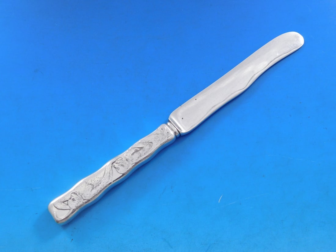 Tiffany Sterling Silver Acid Etched Dessert Knife Monkeys 7.25": Tiffany Sterling Silver Acid Etched Dessert Knife Monkeys 7.25" This exquisite dessert knife features the renowned Lap Over Edge pattern, crafted by Tiffany & Co. The knife is made from high-quality s