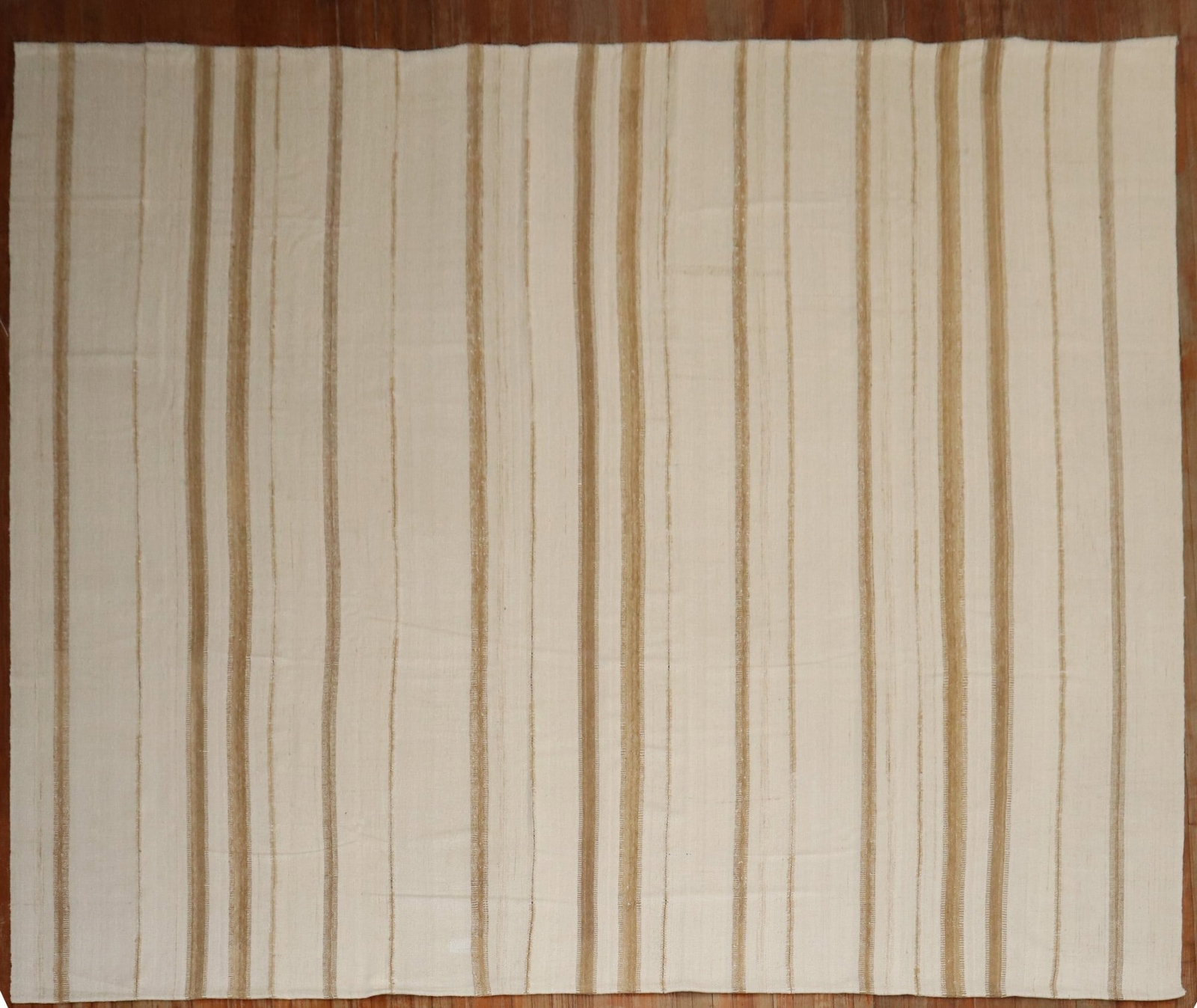 11' 3" x 12' 7" Persian square kilim rug in brown and ivory stripes: 11' 3" x 12' 7" Persian square kilim rug in brown and ivory stripes Persian square kilim from the 3rd quarter of the 20th century featuring a striped design in soft brown and ivory. This pre-owned rug