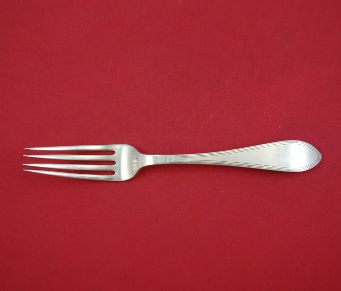 Tiffany & Co Reeded Edge Sterling Silver Dinner Fork 7 7/8": Tiffany & Co Reeded Edge Sterling Silver Dinner Fork 7 7/8" This exquisite dinner fork from Tiffany & Co. features the classic Reeded Edge pattern, crafted from high-quality sterling silver. Measuring