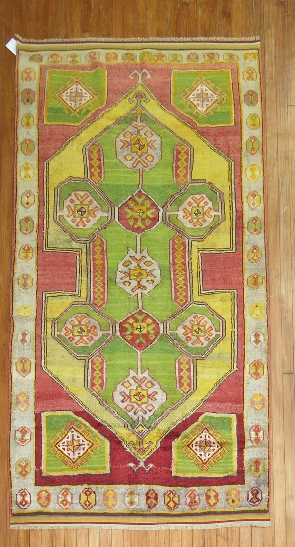 4' 4" x 7' 2" Turkish Konya Accent Rug: 4' 4" x 7' 2" Turkish Konya Accent Rug Vintage Turkish Konya accent rug with a geometric design and lime green and red accents. This 20th century pre-owned rug offers a distinctive decorative look con