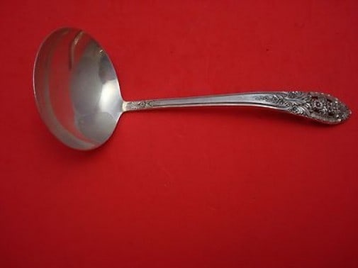 International Sterling Silver Crown Princess Gravy Ladle 6.5": International Sterling Silver Crown Princess Gravy Ladle 6.5" This exquisite gravy ladle is crafted from high-quality sterling silver, featuring the elegant Crown Princess pattern by International.