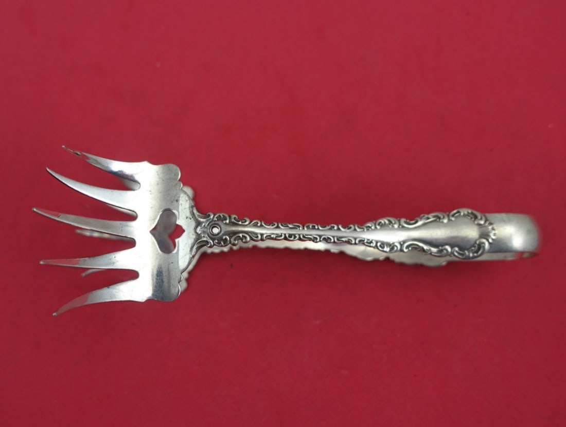 Whiting-Gorham Louis XV Sterling Silver Sardine Tong 5 3/4": Whiting-Gorham Louis XV Sterling Silver Sardine Tong 5 3/4" This exquisite Louis XV sardine tong, crafted by Whiting-Gorham, is an elegant addition to your serving pieces. Made from sterling silver (.