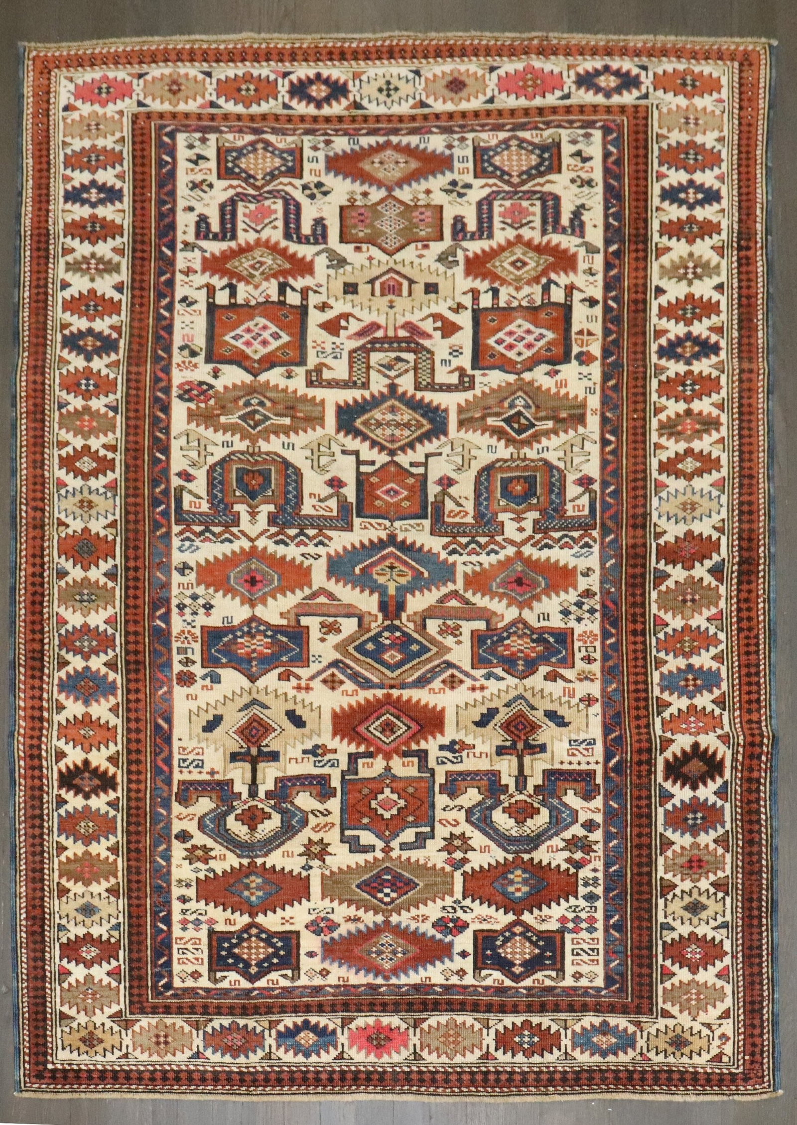 4' x 5' 6" Antique Kuba Accent Rug Caucasian Rustic Colors: 4' x 5' 6" Antique Kuba Accent Rug Caucasian Rustic Colors Late 19th century Caucasian Kuba accent rug in rustic colors. This pre-owned piece reflects the traditional Kuba style and is presented as an