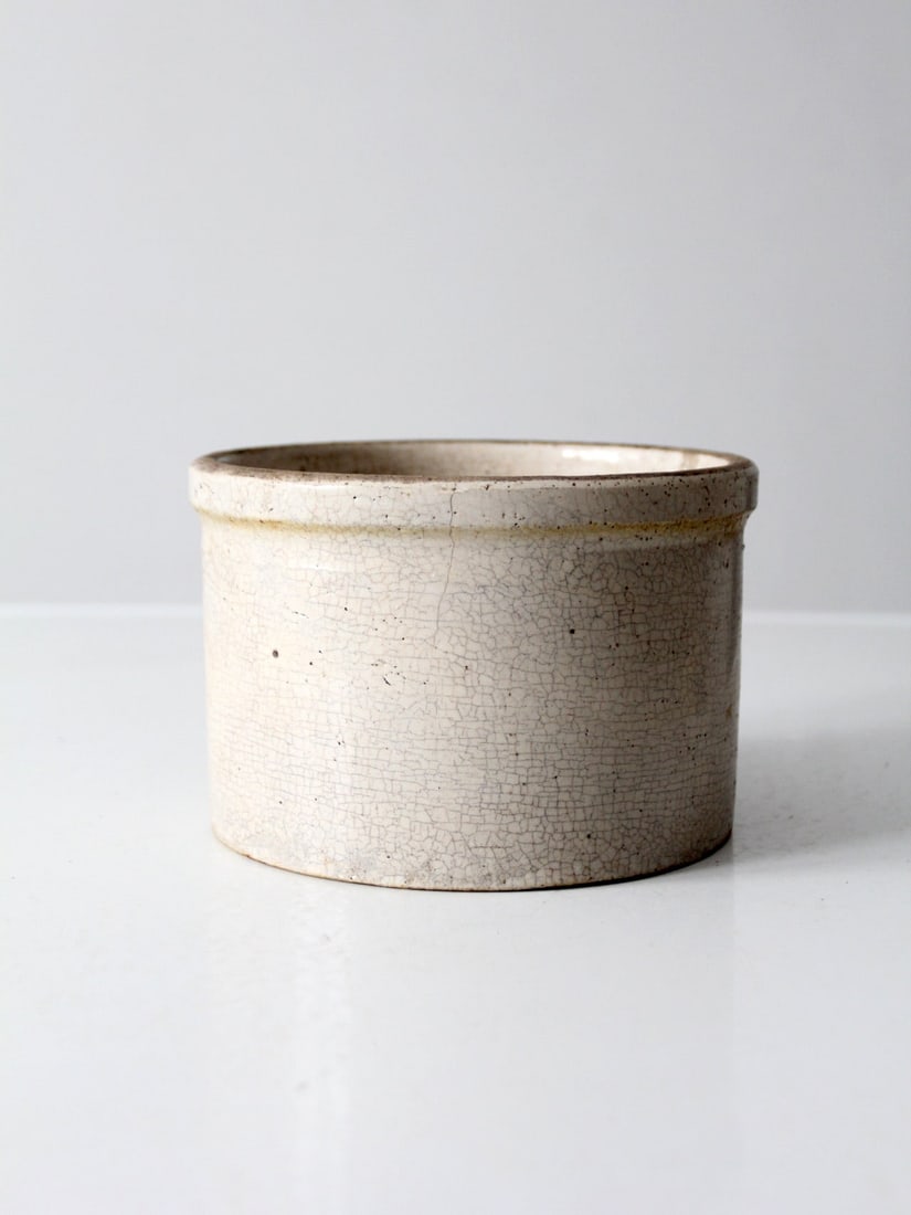 Antique Macomb Stoneware Crock 7.25 Diameter 4.75 Height: Antique Macomb Stoneware Crock 7.25 Diameter 4.75 Height This antique Macomb stoneware crock showcases a soft cream glaze and a classic American design, embodying the simplicity of early utilitarian p